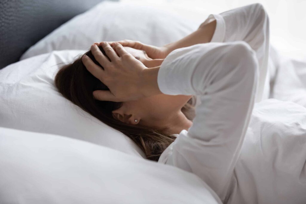 Woman experiencing sleep apnea symptoms in New York, NY